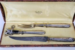 A silver handled cased carving set, Hock holder with French retailers name marked Paris