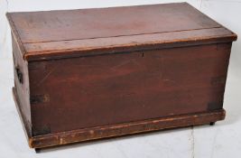 A Victorian pine blanket box. Plinth base with panelled sides, carry handles to each end with hinged