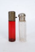 A Victorian cranberry glass silver topped single vial perfume bottle together with a clear glass
