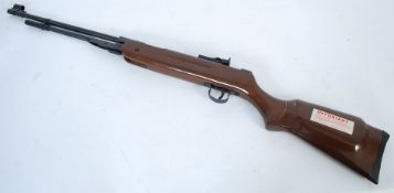 A Chinese made air rifle having lever action with wooden stock