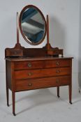 An Edwardian mahogany inlaid dressing chest of drawers table. The plinth base supporting a chest