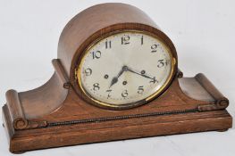 A large oak cased Westminster chime mantel clock originally retailed by Kemp Bros of Bristol. The
