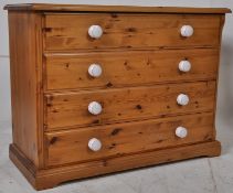 A Victorian style pine country chest of drawers each having porcelain knob handles. Flared edge