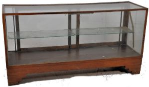 A 1930`s Art Deco oak and glass shop haberdashery display counter / cabinet. Raised on stepped deco