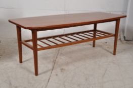 A Danish 1970`s solid teak Mogens Kolo large lozenge shaped coffee / occasional table. Raised on