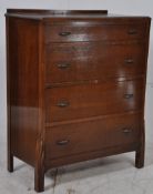 A 1930`s Art Deco oak chest of drawers. Raised on rocket shaped atomic feet having an upright chest