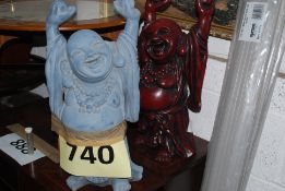 Two resin cast statues of buddha.