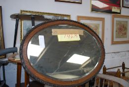 A satin wood Edwardian mirror with inlay.
