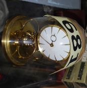 A 1950's Kundo glass domed anniversary clock with key