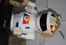 A Scooter 2000 battery operated toy robot with light up eyes and remote control.