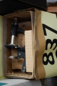 A vintage 20th century childs / students microscope complete in the original box