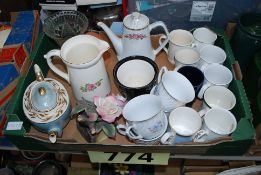 A mixed lot to include water jug, dogs, teapots, cups, glass vase etc.