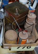 Two boxes to include vintage oil tins, Primus burner, Carriage lamp and other items.