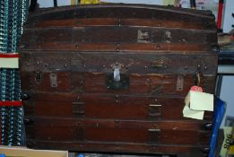 A Victorian dome top leather and wooden bound trunk (AF)