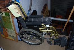 A gold metal plated wheelchair