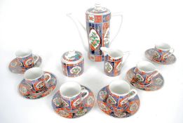 A decorative Japanese oriental tea set with teapot, cups and saucers etc.