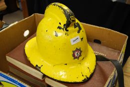 A vintage yellow leather firemans helmet for the county of Avon fire brigade marjked N.Love to