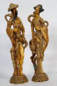Two Chinese resin figurines. One of a merchant, the other a lady.