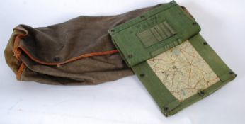 An original WWII military army tank canvas sleeping bag along with an original tank commanders map