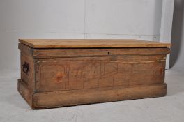 A Victorian pine blanket box with plinth base, carry handles to sides all being under a later