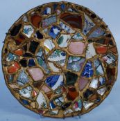 A 20th century ceramic mosaic plate made from pieces of vintage pottery. 23cm diameter.