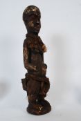 An African fertility carving of a pregnant tribal women