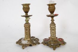 A good pair of Victorian rococo influenced brass candlesticks. Raised on terraced bases with column