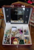 A selection of assorted costume jewellery contained within a good electrical light up jewellery box