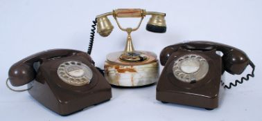 Two vintage brown ring dial office telephones along with another in marble