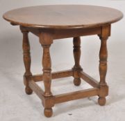 An 18th century style oak peg jointed table by Reeves of Marshfield and Chippenham. Retailers label