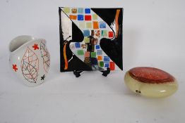 A glass plate along with a studio glass heart shaped piece along with a retro vase.