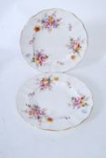 A pair of Royal Crown Derby cabinet plates having foliate decoration, gilt applied borders being