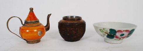 An antique oriental bowl and a carved wooden censur along with an onyx orange miniature teapot.