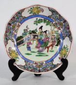 A Qian Long style Chinese oriental hand painted stoneware scallop edged dish with qianlong marks to