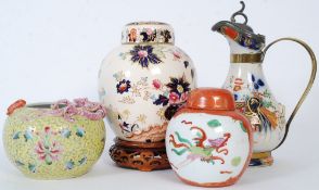 Two Chinese ginger pots, one on a socle base along with oriental pots with and Hydra jug in the