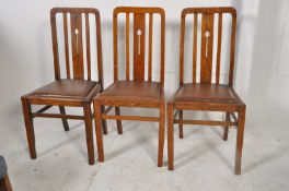 A set of 3 Victorian Arts & Crafts oak dining chairs. The square tapered legs united by high