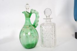 A green bohemian glass decanter together with an English cut glass decanter