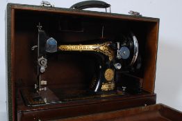 A 1960`s faux crocodile cased singer sewing machine