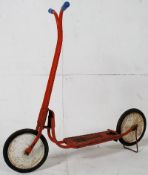 A 1950`s Triang metal childs ride on toy scooter.