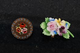 A Victorian enamel decorated circular brooch stylised with flowers together with an Anysley floral