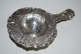 A 19th century German rococo silver hallmarked 930 / 925 tea strainer. German silver marks to