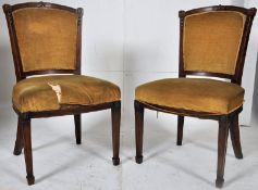 A pair of Victorian upholstered dining chairs with yellow velour.