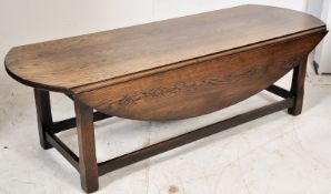 A large oak drop leaf coffee table / wake table in the 18th century style