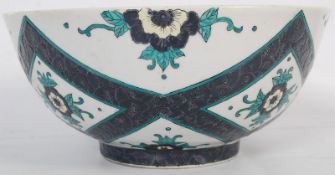 A large antique Japanese bowl with `may poison food` to base.