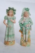 A pair of continental bisque figurines of Napoleon and Josephine. 23cm tall.