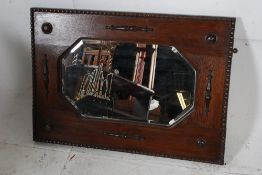 An Edwardian oak framed bevelled edge mirror