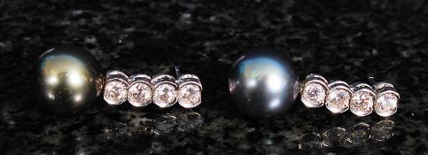 A pair of 18ct white gold sea pearl and diamond earrings. 6.6g