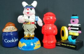 A Duracell advertising bunny, along with a Van Dal shoe statuette, Bassetts figure etc