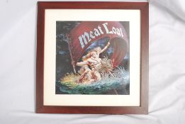 A framed presentation of a Meatloaf record LP cover.