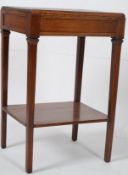 A 1930's Art Deco oak side / lamp table. Raised on squared legs united by stretchers having